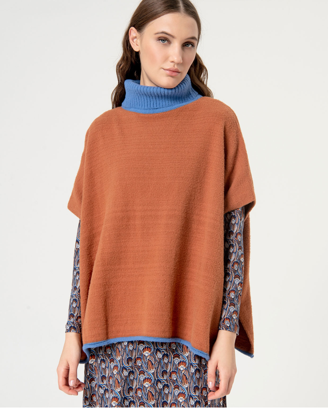 Poncho uni en maille...