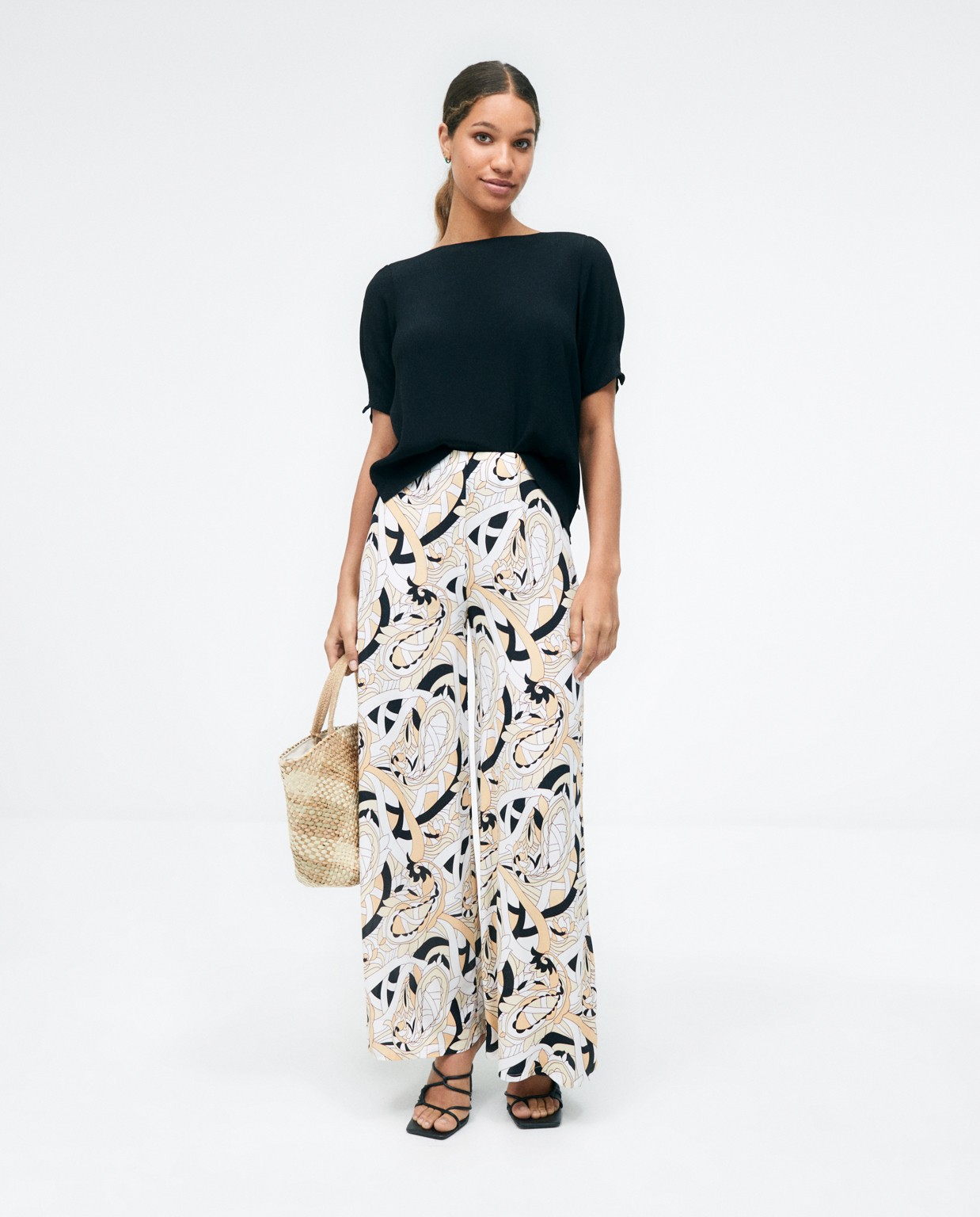 Pantalon long et très large. Imprimé  Beige