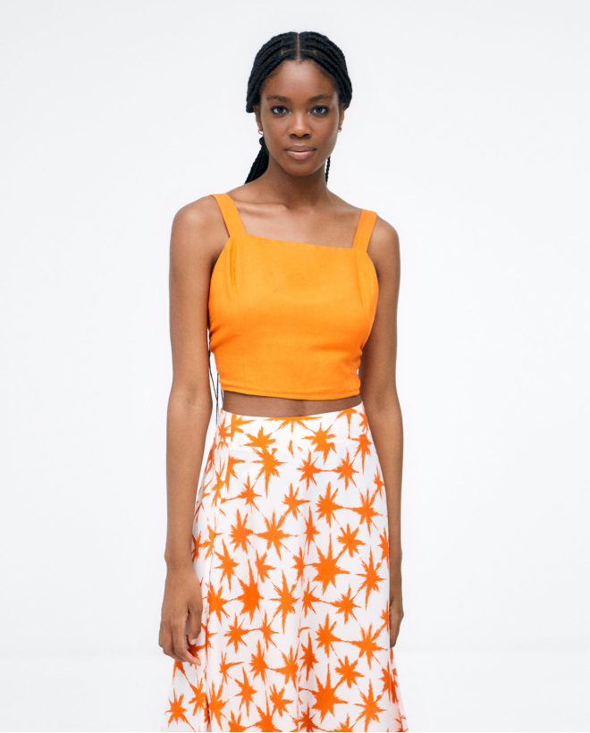 Jupe midi évasée. Imprimé Orange